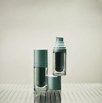 15ml Aramore NAD+ Cell Energizing Treatment bottle and 15ml Aramore NAD+ Cell Restoration Cream bottle on a white background