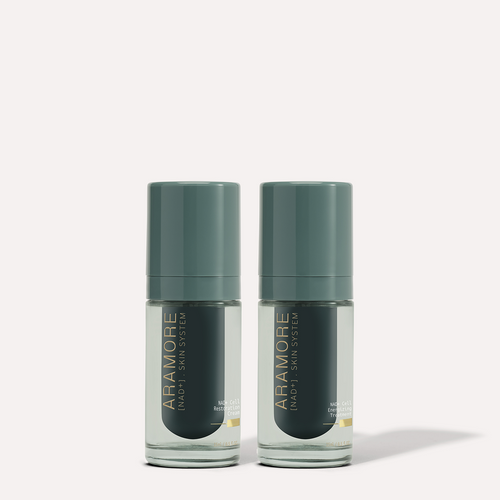 15ml Aramore NAD+ Cell Energizing Treatment bottle and 15ml Aramore NAD+ Cell Restoration Cream bottle on a cream background