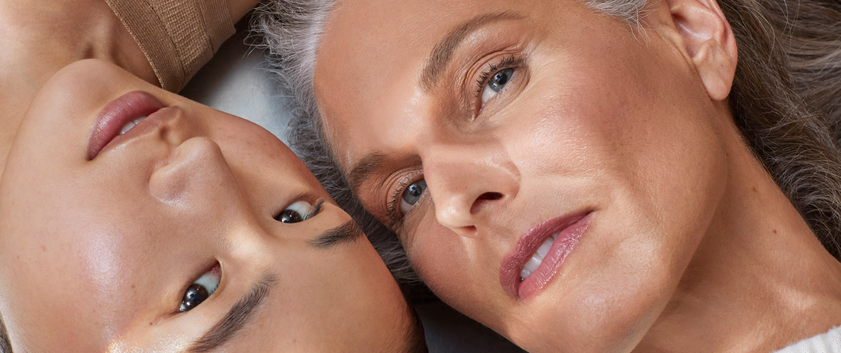 Close-up of two women with healthy, radiant skin